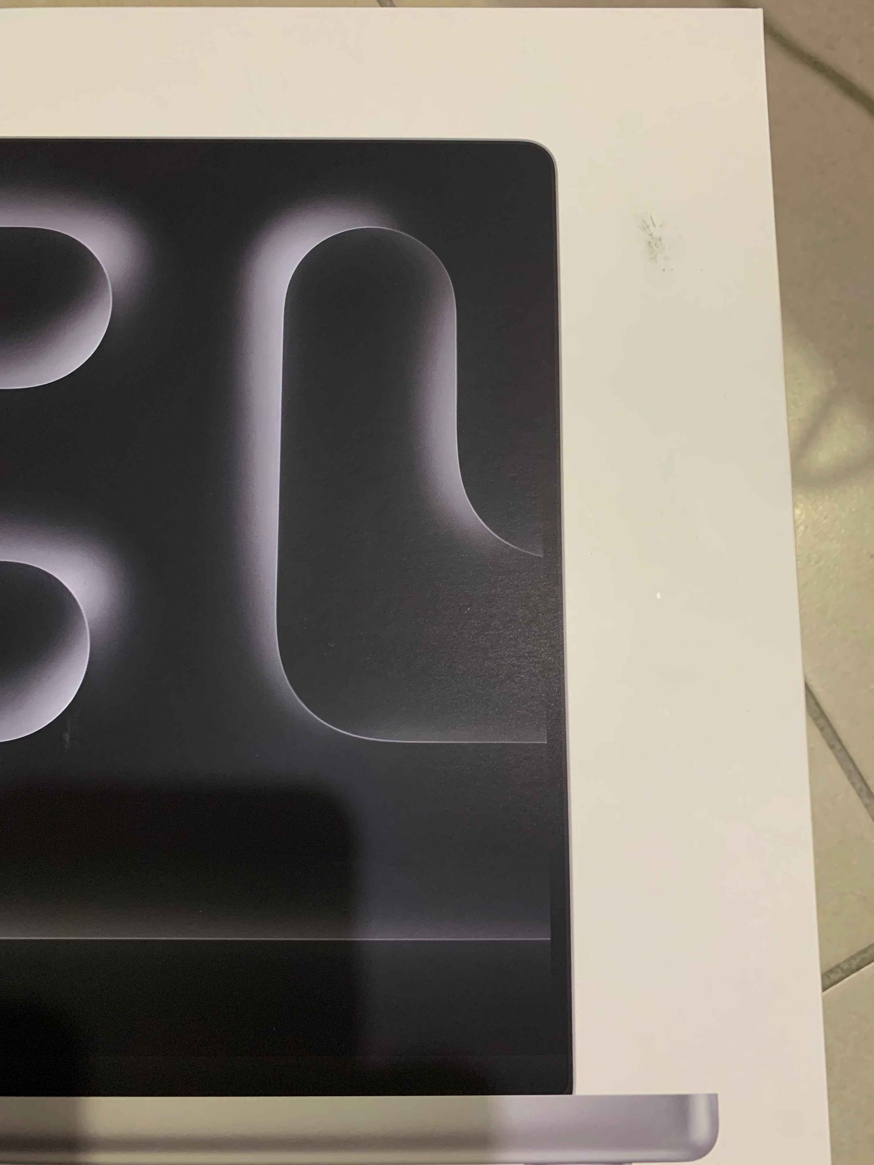 Stain in the top-right, beside the display